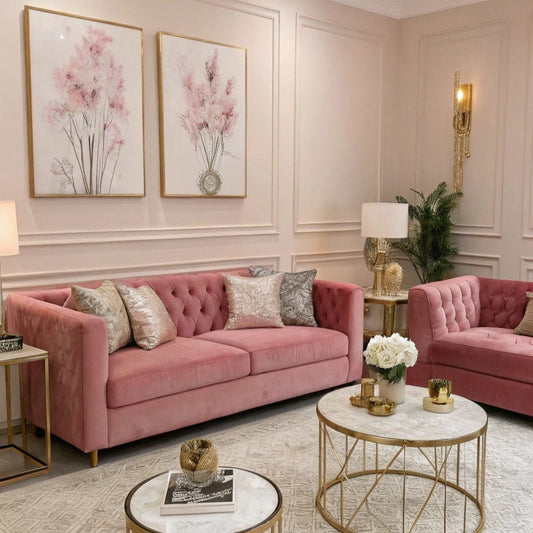 Pink sofa in a stylish living room with gold coffee tables and floral decorations.